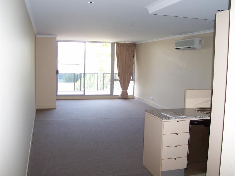 Kitchen and Living area from Media Centre outside bathroom.