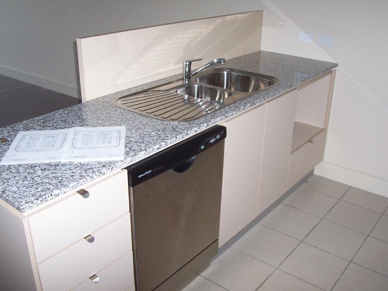 Kitchen Bench with sink and dishwasher. Space under bench for Microwave.